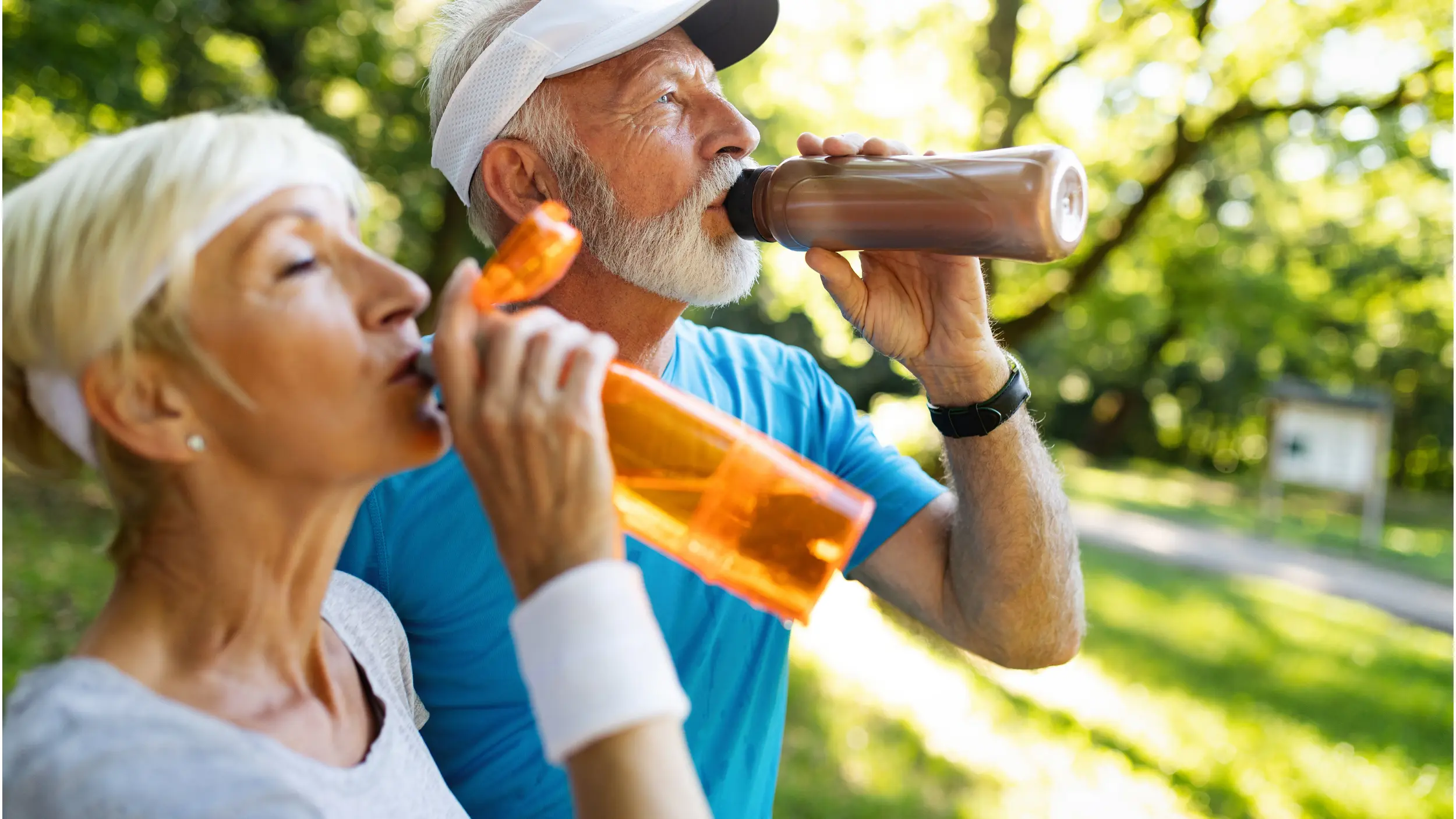 Couple drinking water in the summer