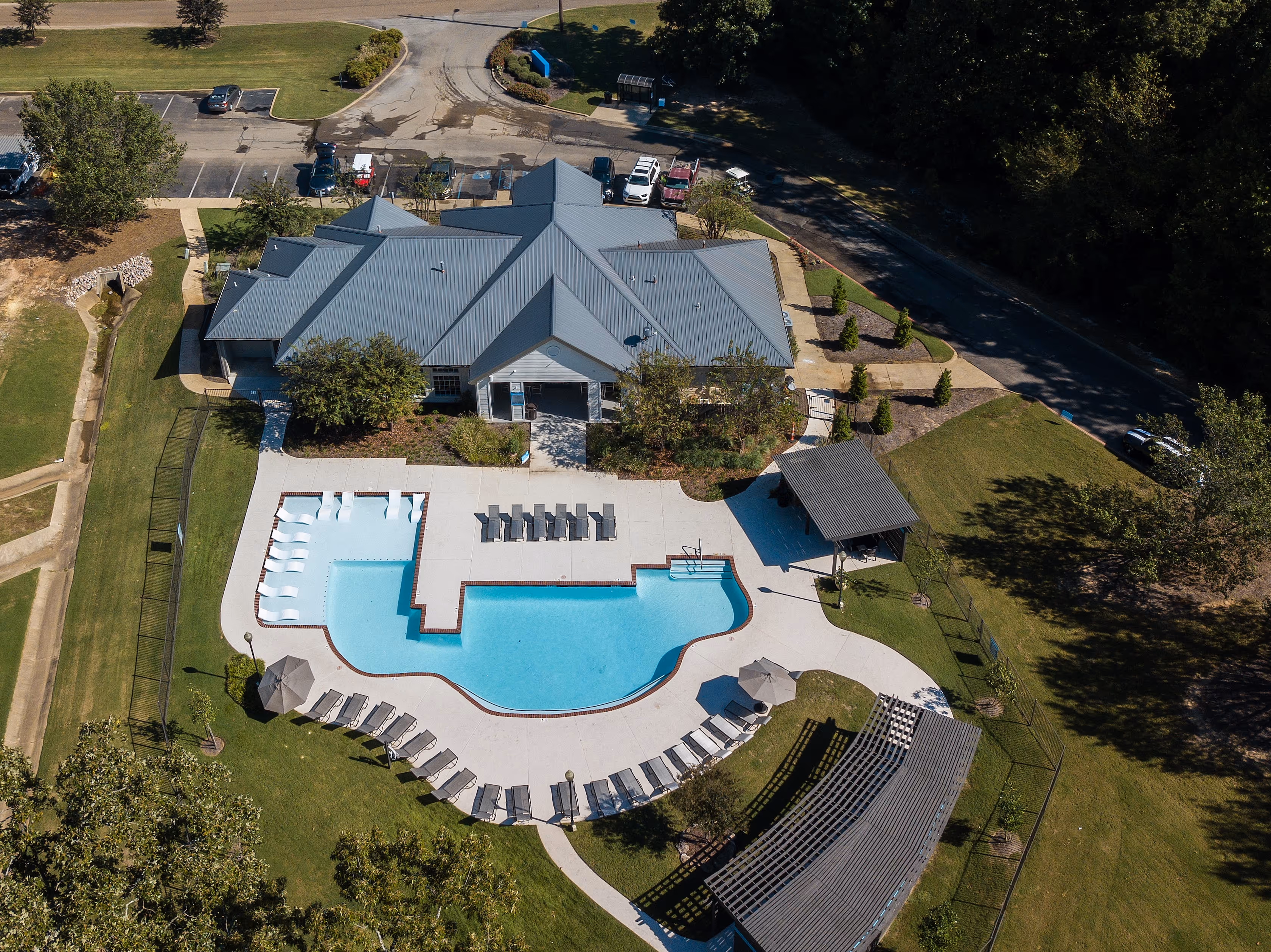 Drone over head shot of swimming pool and exterior