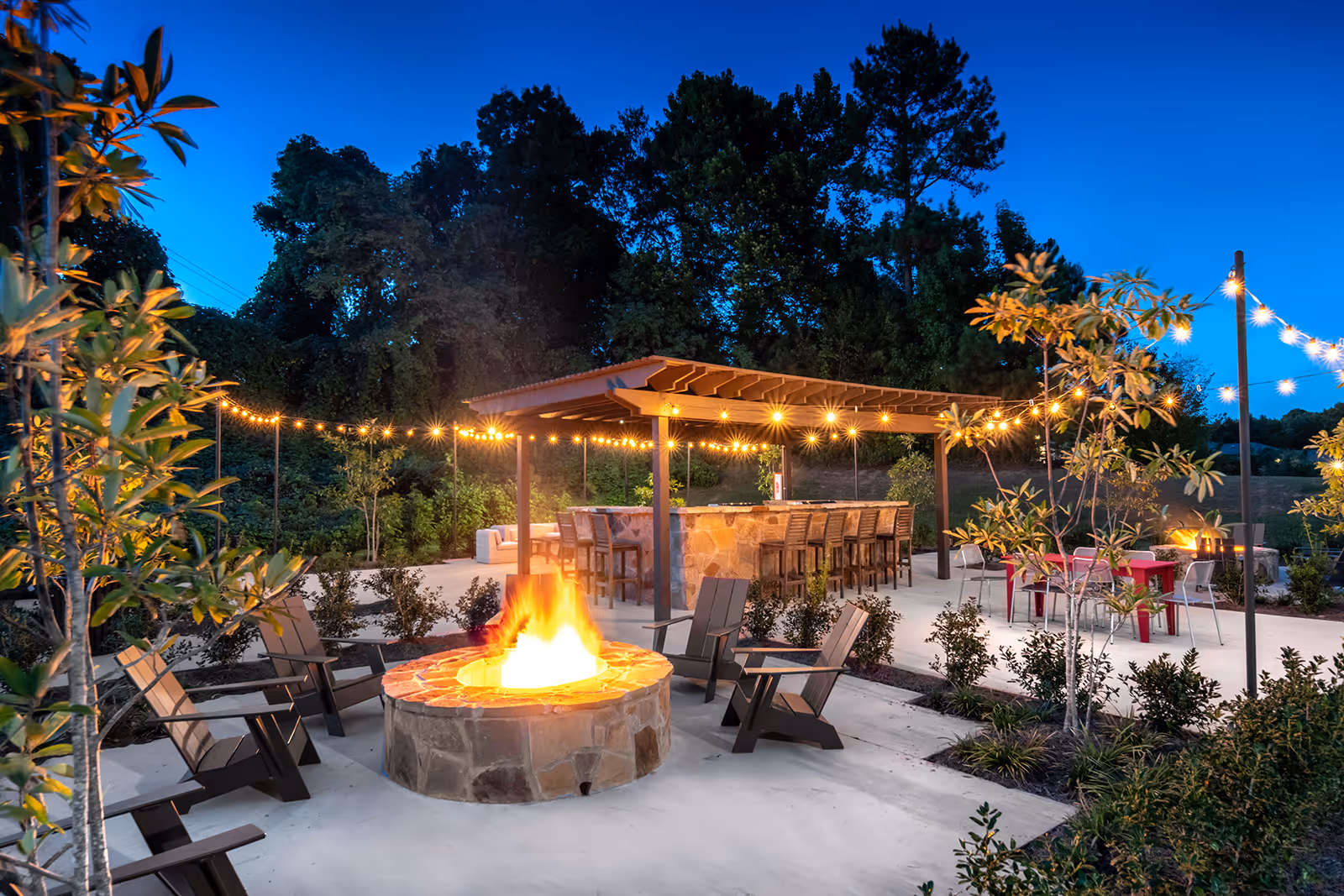 Fire pt and BBQ Grill area with chairs and tables