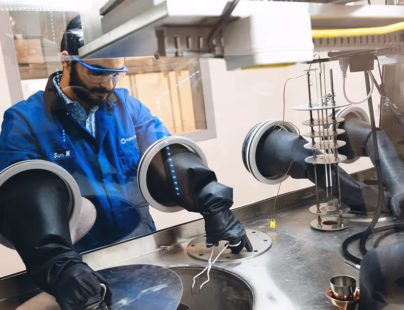 Worker using sterile environment to handle components