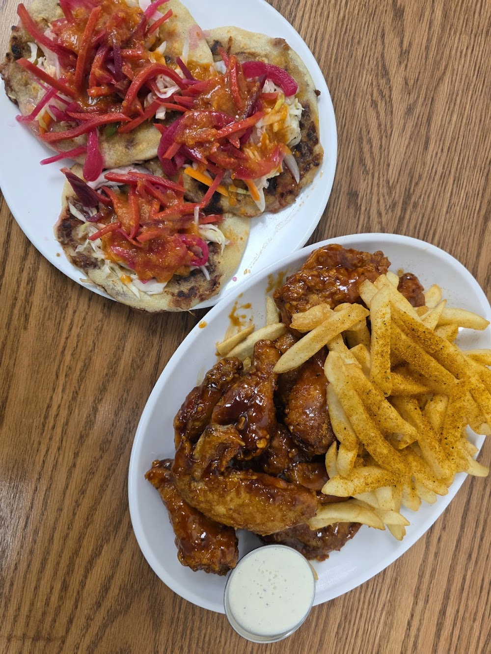 A plate of food with a white sauce on it.