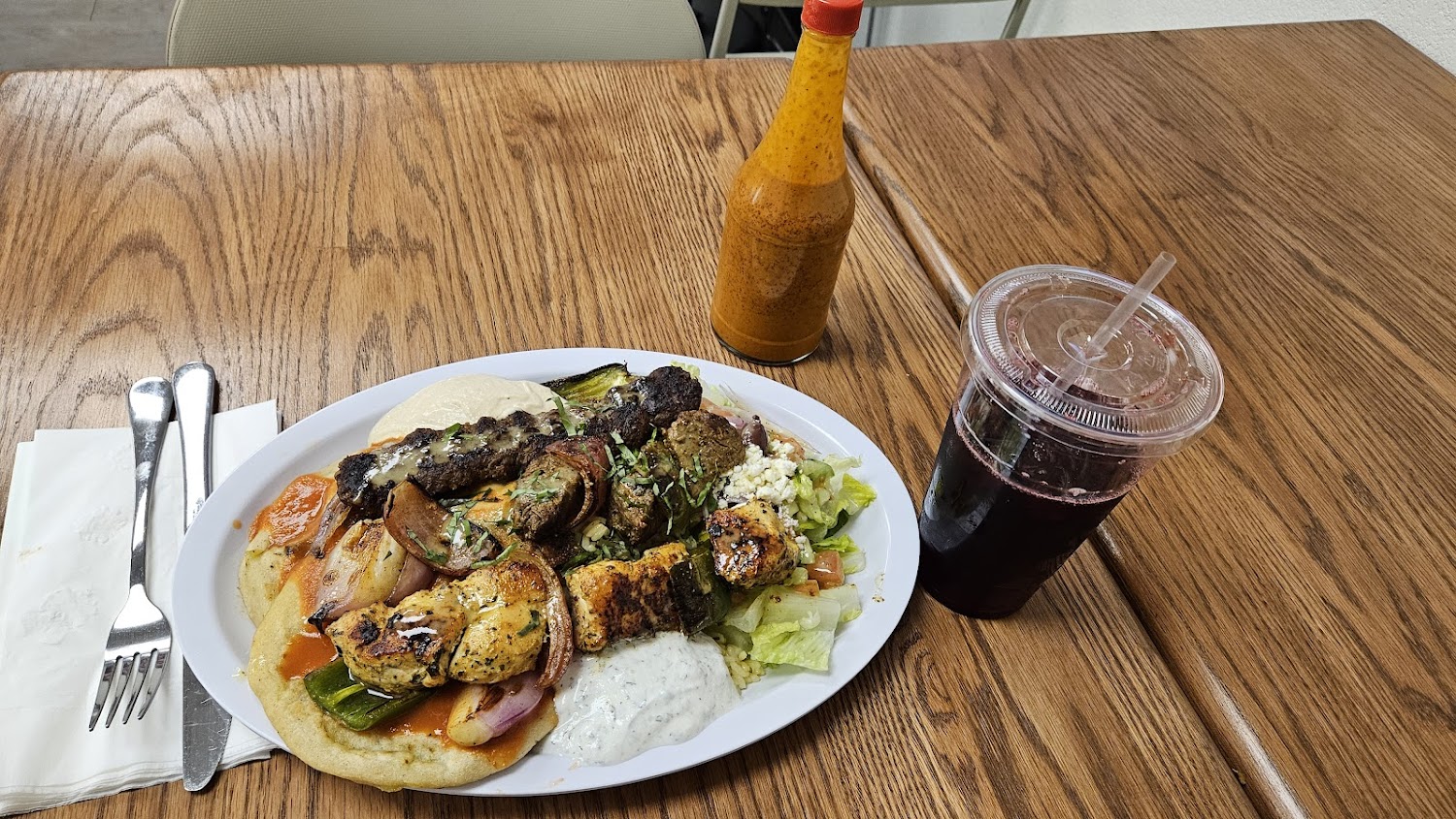 A plate of food with a drink next to it.