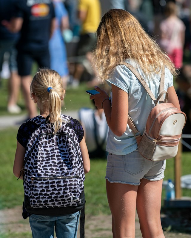 Parent walking her daughter to school