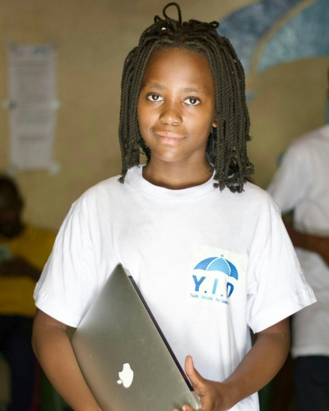 Student holding a laptop