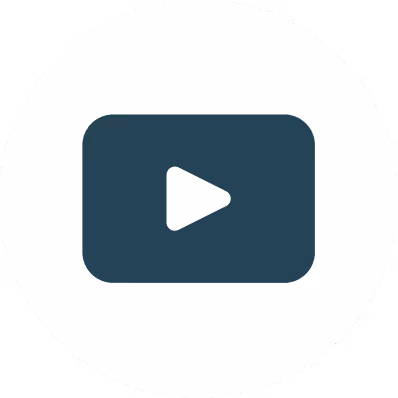 Dark video play button icon with a white triangular play symbol in the center on a circular white background.