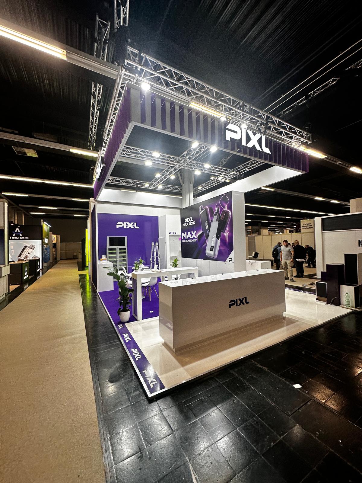 Exhibition stand with overhead branding, product displays and reception counter
