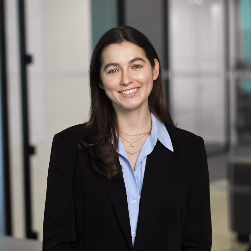 A businesswoman in professional attire smiles warmly, wearing a blazer and light blue shirt. Previously with Clark, Smith, & Villazor LLP, placed with Profound. Text overlay reads “Education: University of Pennsylvania, Past company: Clark, Smith, Villazor LLP.