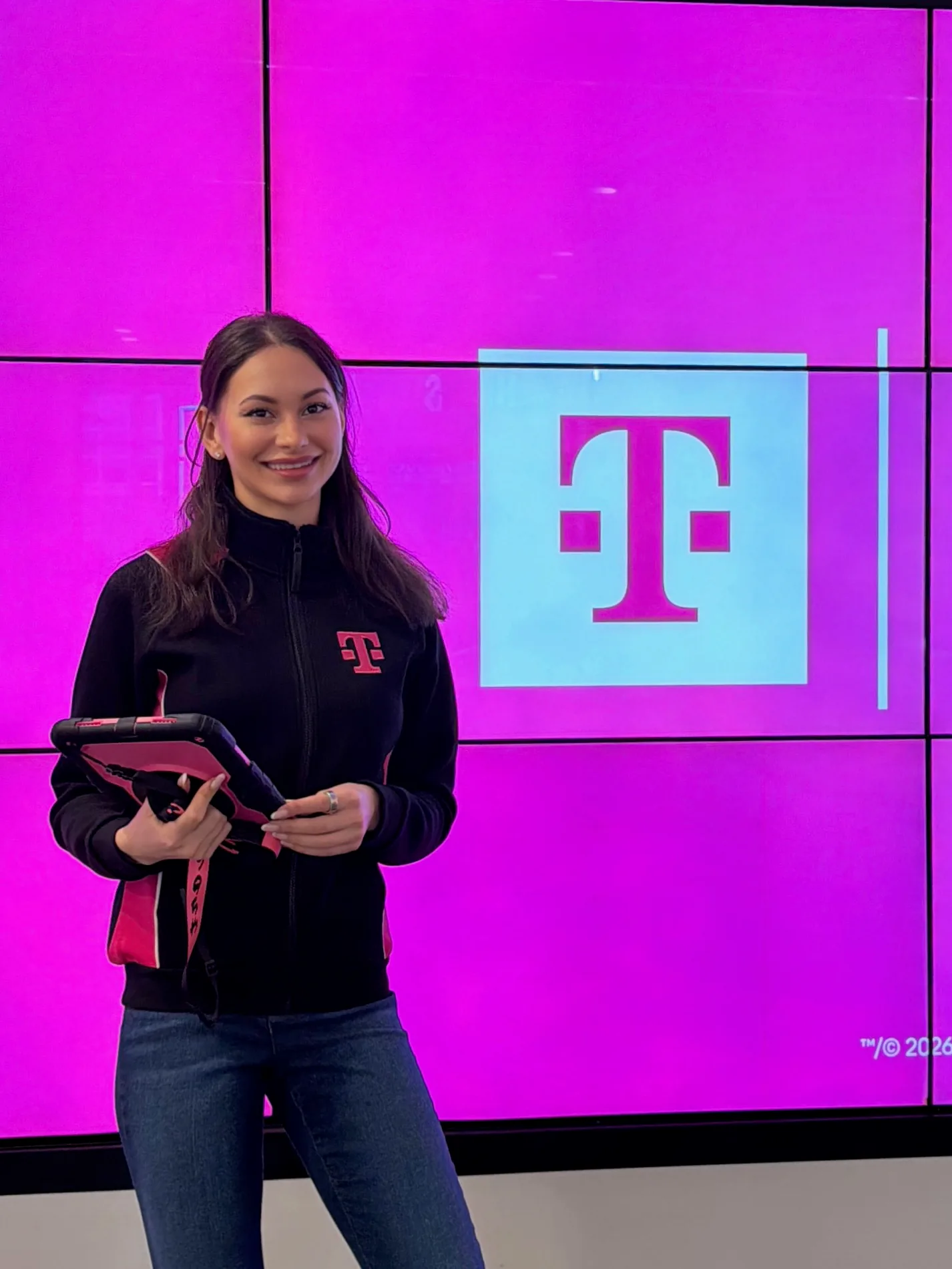 TLC Models T-Mobile brand ambassador with a sales tablet in a New York store