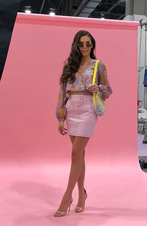 TLC Models model on a fashion shoot against a pink backdrop