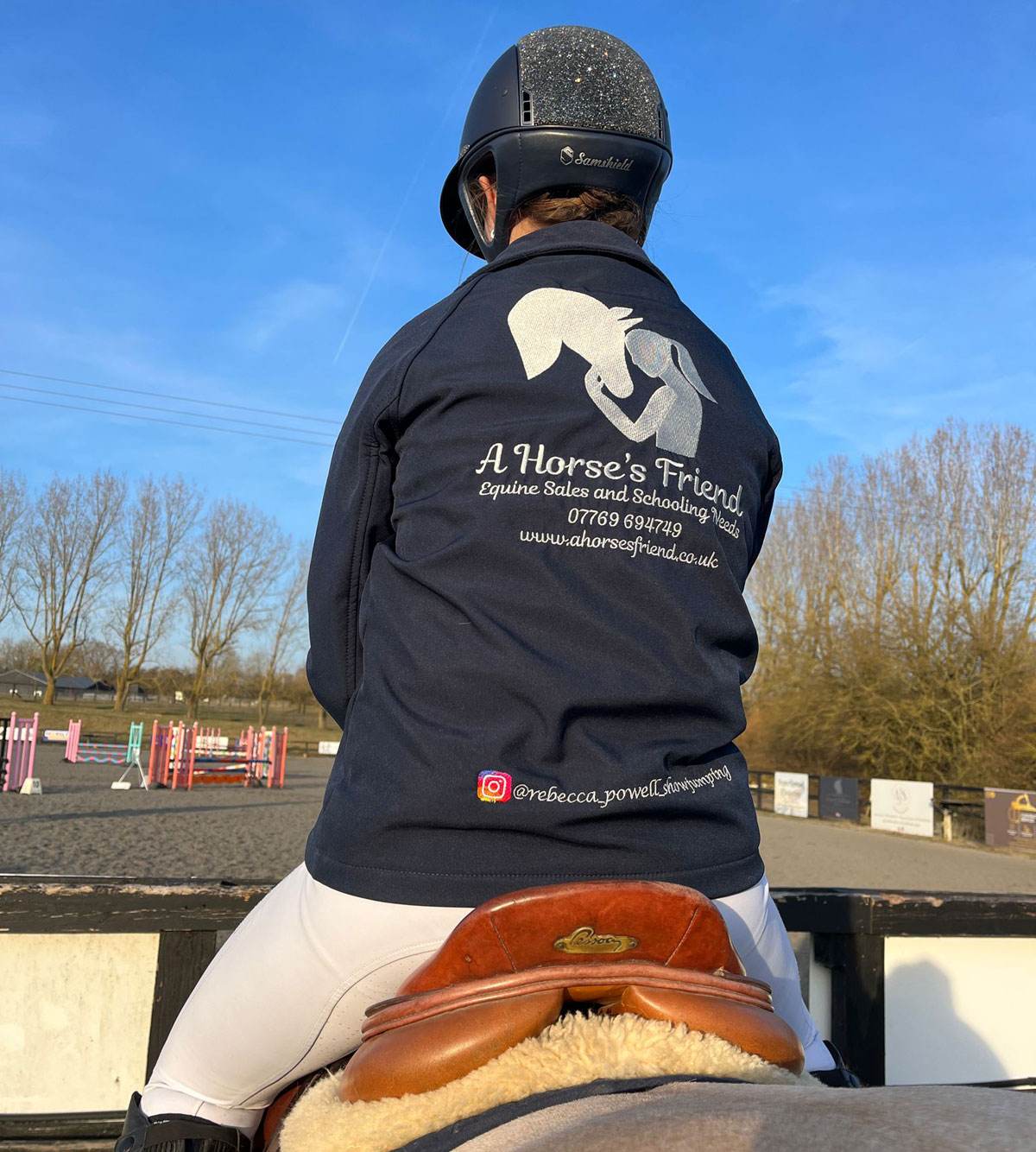 Rider wearing A Horse’s Friend jacket on a pony at a showground in Essex, promoting equine sales and schooling livery services.