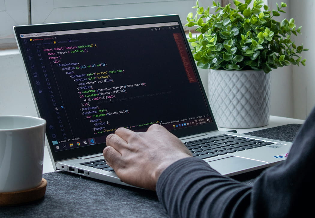 Hands working on website code
