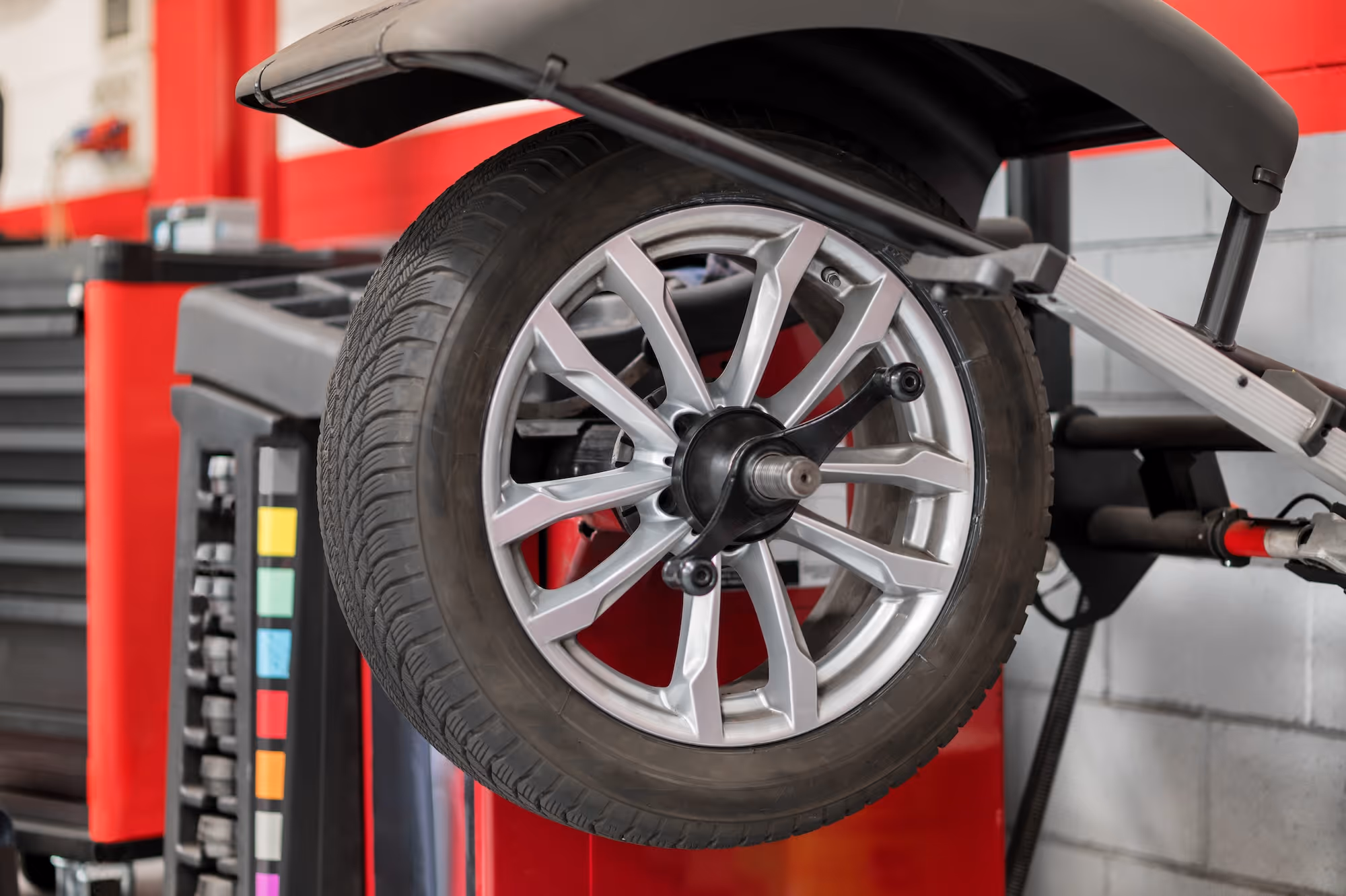Closeup of a wheel on a wheel alignment tool.