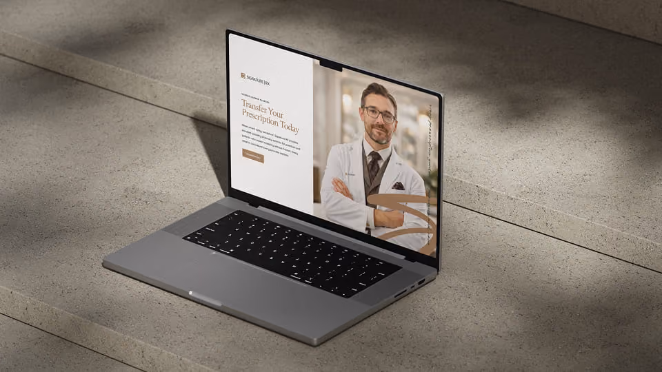 Open laptop on stone steps displaying a prescription transfer webpage with a male doctor in a white coat and glasses, arms crossed, smiling.