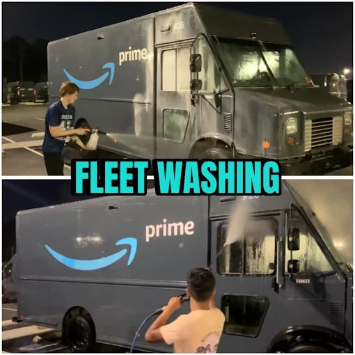 Two young men washing dark blue Amazon Prime delivery vans in a parking lot at night.