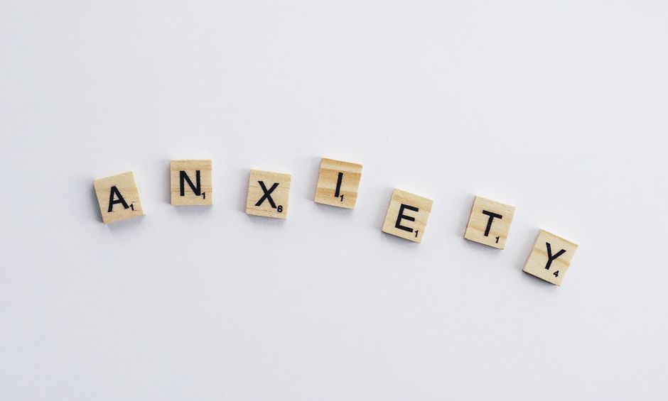 Letter tiles spelling anxiety, a high-intent keyword therapy clients search for