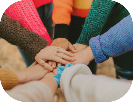 A group of people's hands overlapping each other.