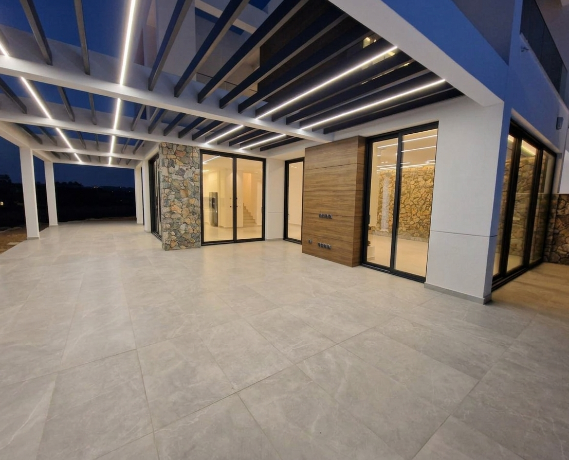 Covered terrace with pergola lighting at night, Sea Caves villa, Peyia, Paphos