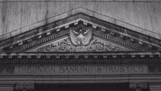 Facade detail of the Union Banking & Trust Co building with an eagle sculpture above the entrance.