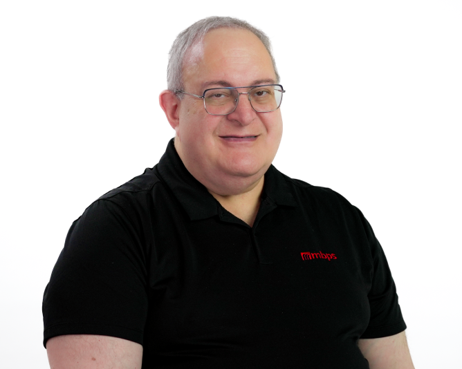 MBPS managed IT support team member smiling in company polo shirt, Phoenix MSP professional headshot