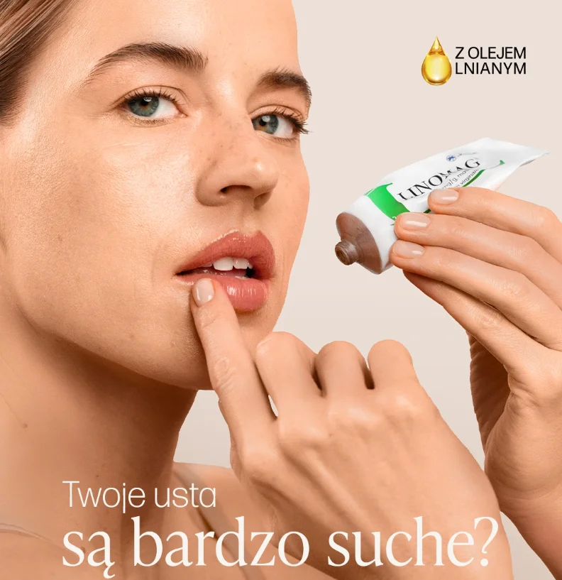 Kobieta nakłada balsam na usta z tubki kremu Linomag, reklamująca produkt z olejem lnianym na suche usta.