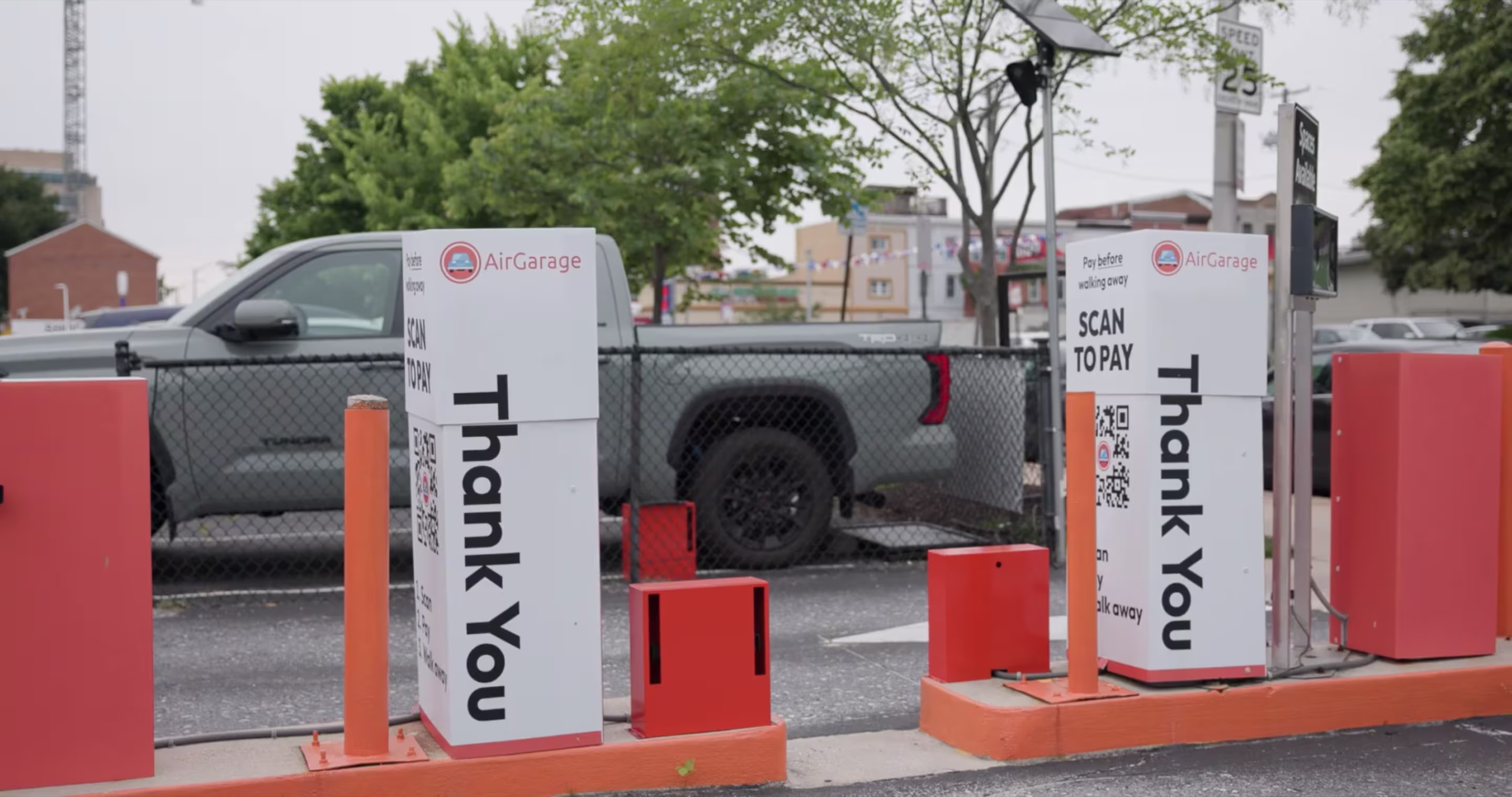 AirGarage scan-to-pay parking payment kiosks installed at an outdoor parking lot