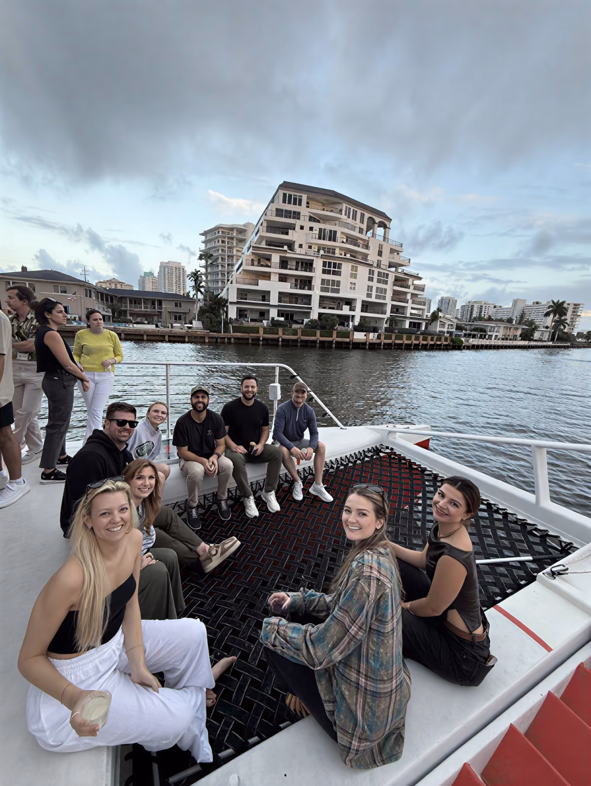 AirGarage team relaxing together on a boat outing along the waterway