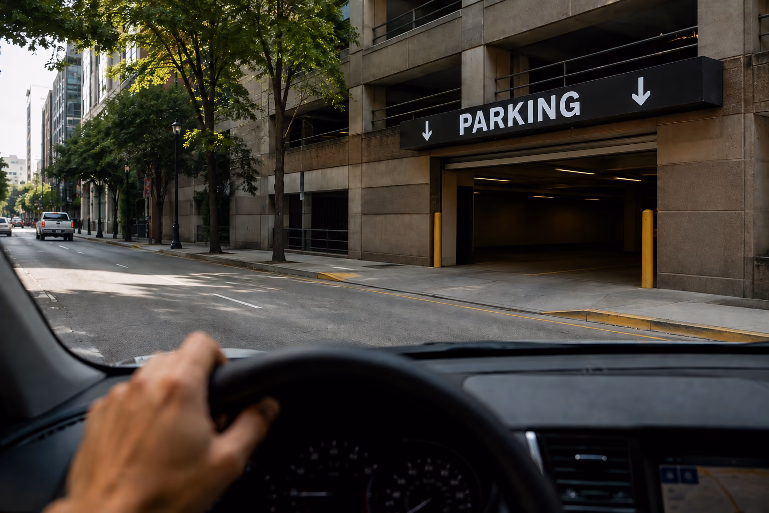 Car pulling into a parking garage, representing transient parking drivers.