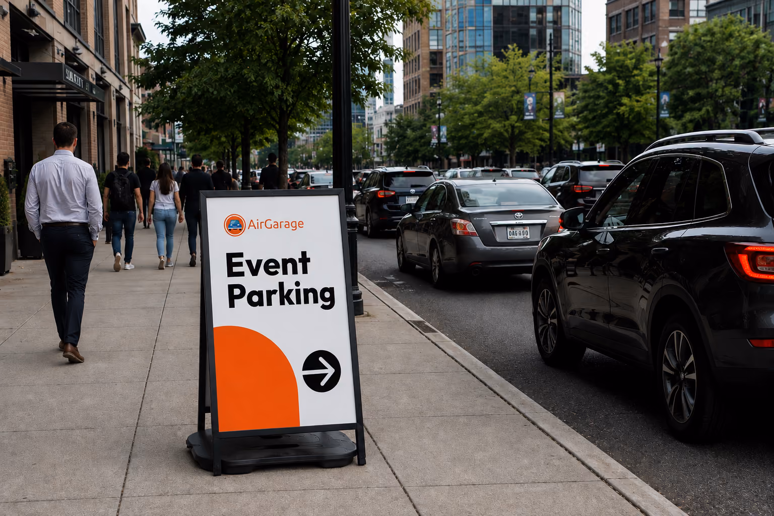 City street with an A-frame sign directing pedestrians to AirGarage event parking.