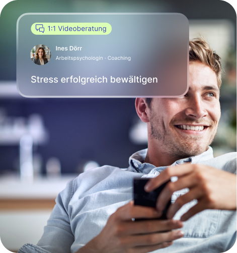 Smiling man holding a smartphone with overlay text about 1:1 video coaching for managing stress by psychologist Ines Dörr.