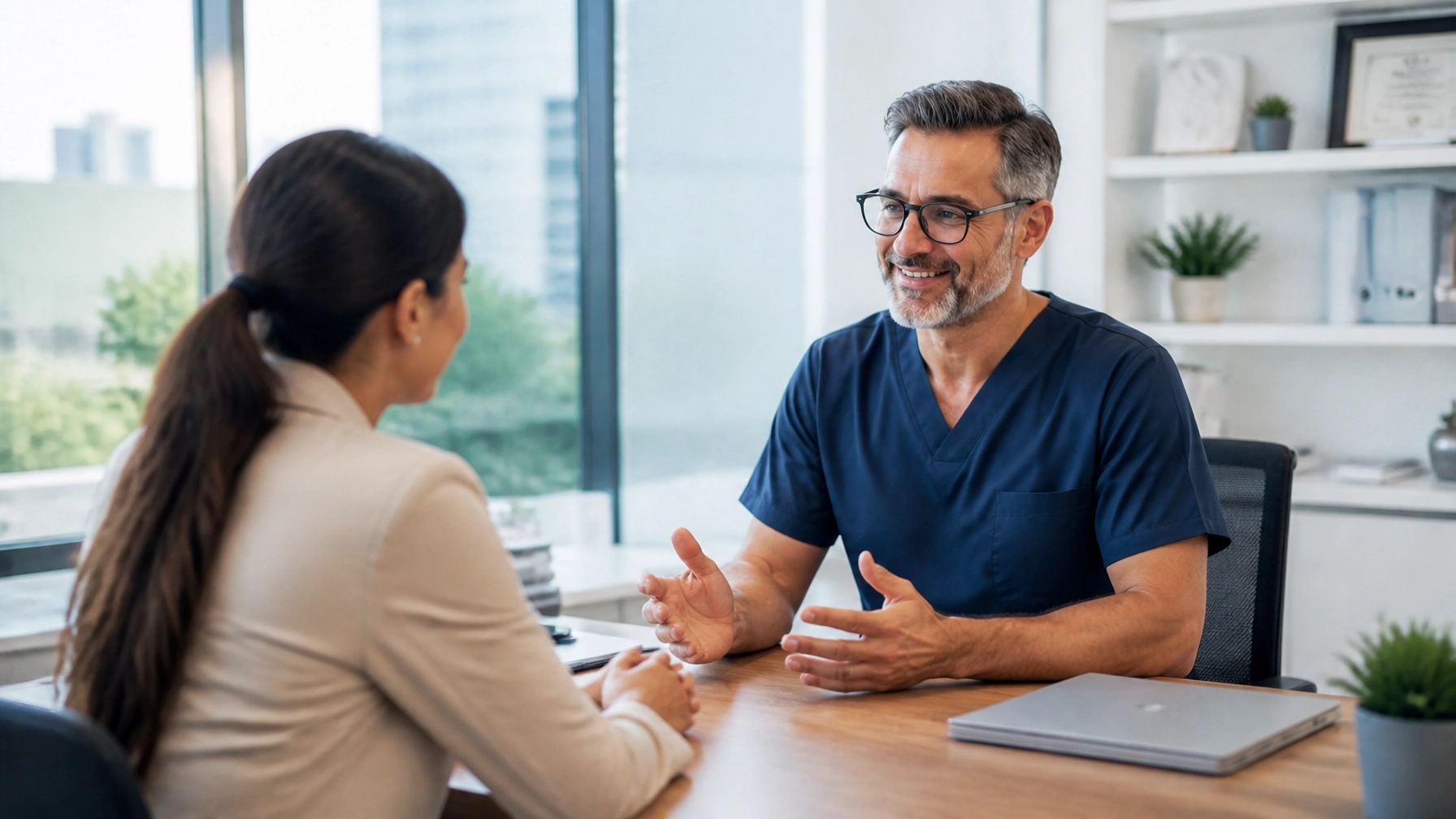 Medical practice administrator discussing growth and cash flow in a clinic office