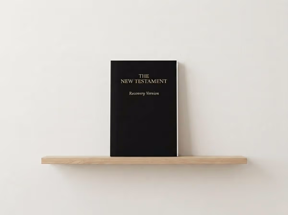 The New Testament Recovery Version Bible with the text: 'Discover the unsearchable riches of Christ in the Holy Scriptures' set against a soft green nature bokeh background.