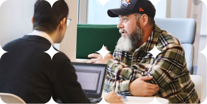 Fedcap UK participant speaking with an adviser during a support session.