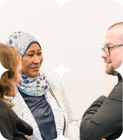 Colleagues in conversation about workplace inclusion and fair pay.