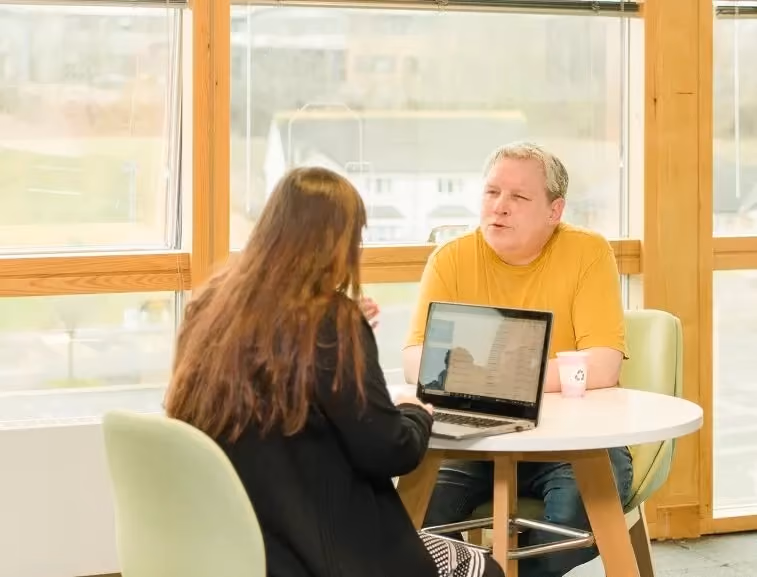 Fedcap Employment participant speaking with an adviser during an employment support session.