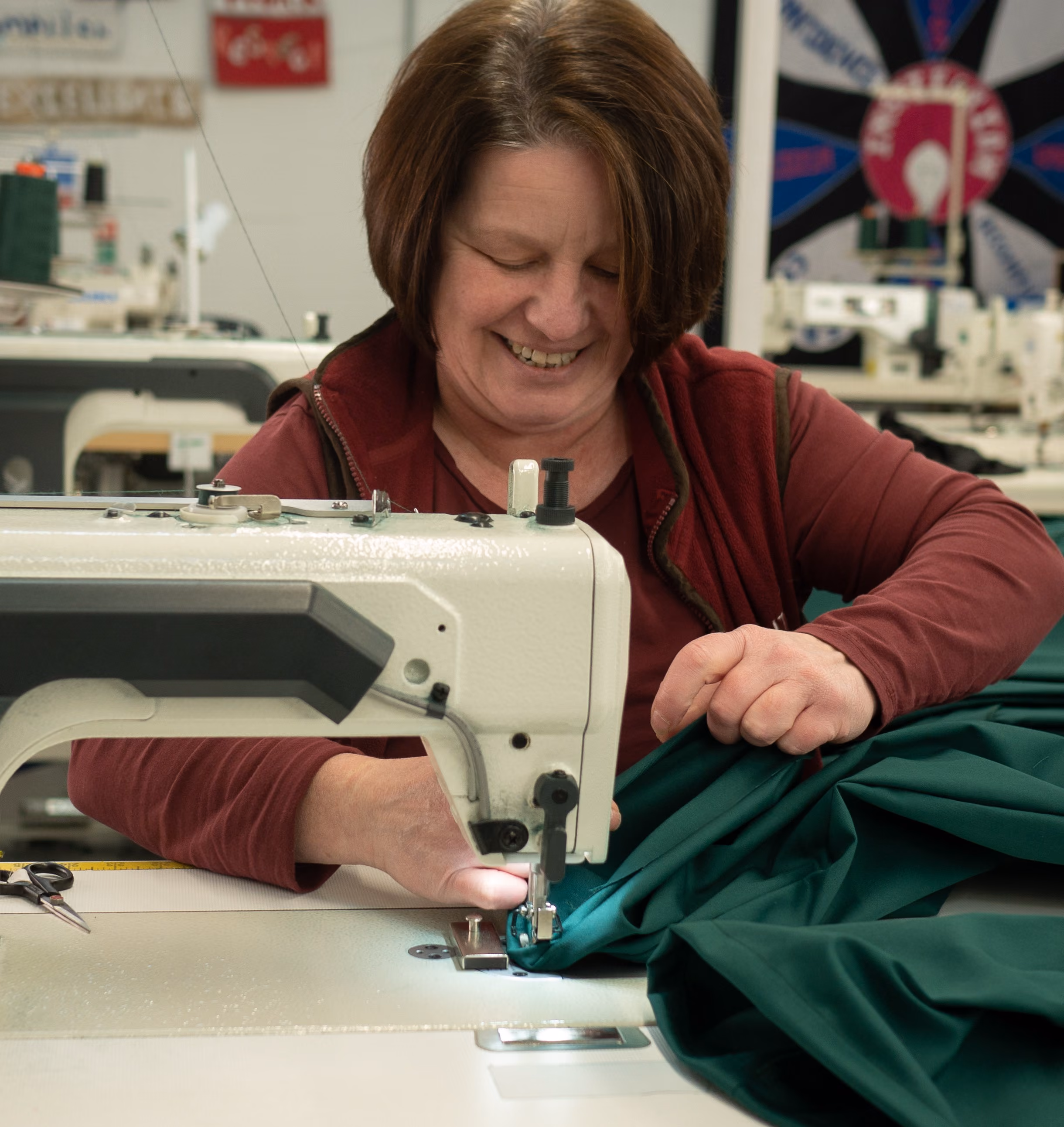 Woman developing vocational skills while working at a sewing machine.
