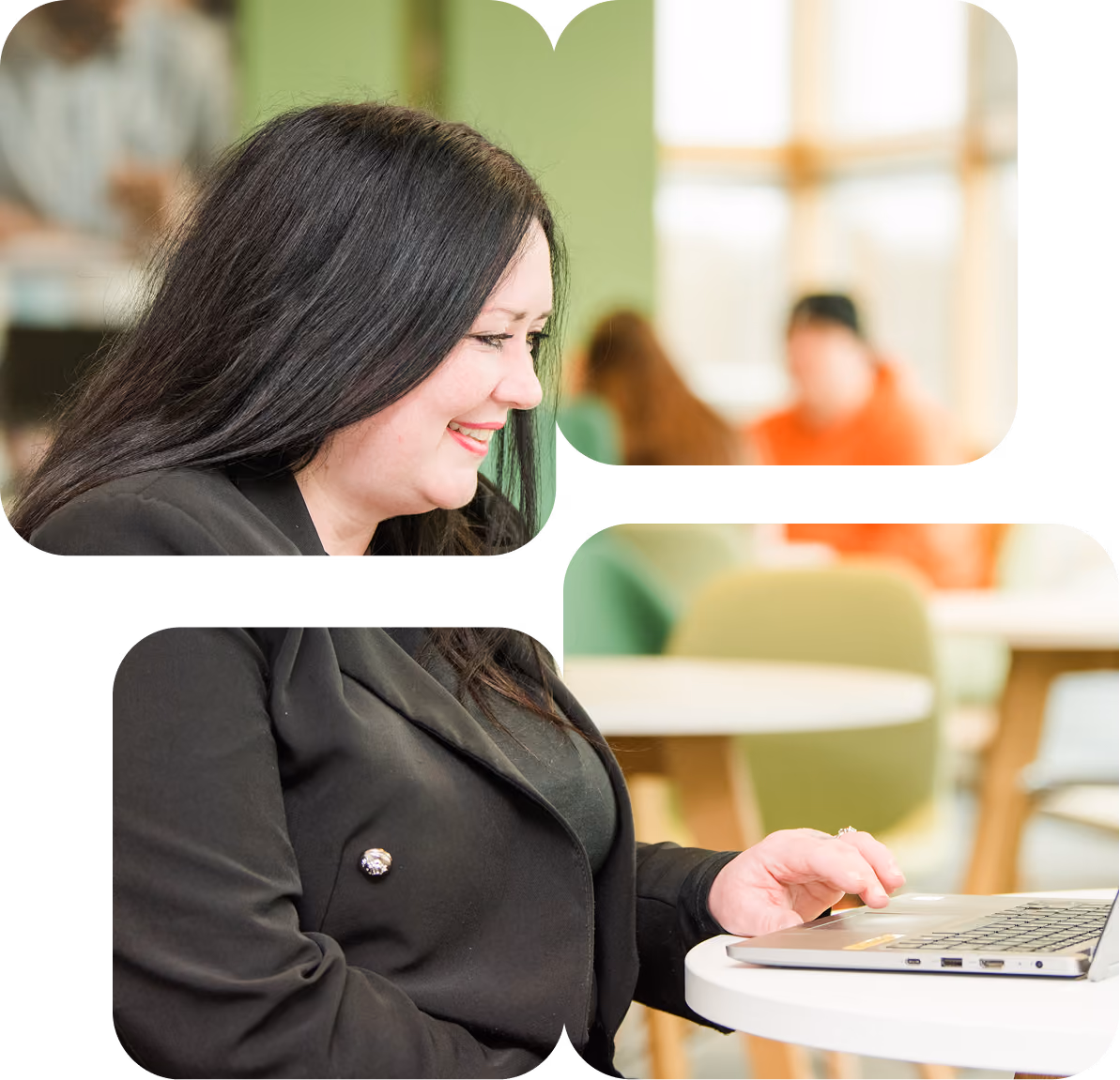 A woman smiling, working on a laptop