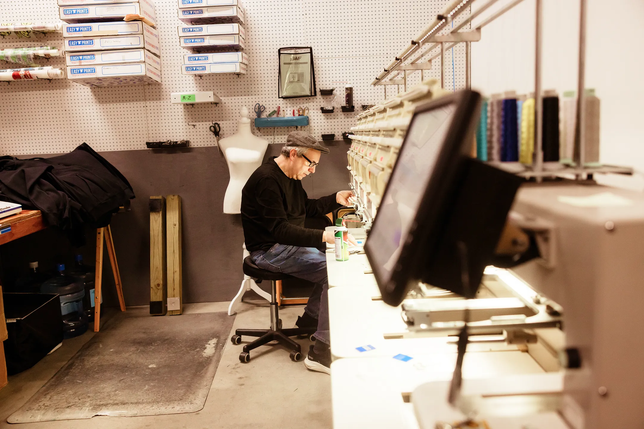 Steve threading the embroidery machine
