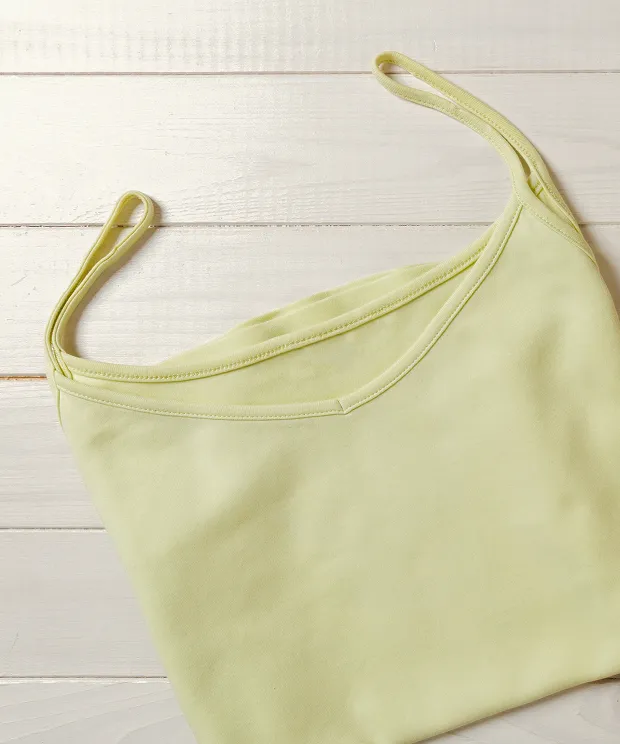 Lime green tank top on wood background