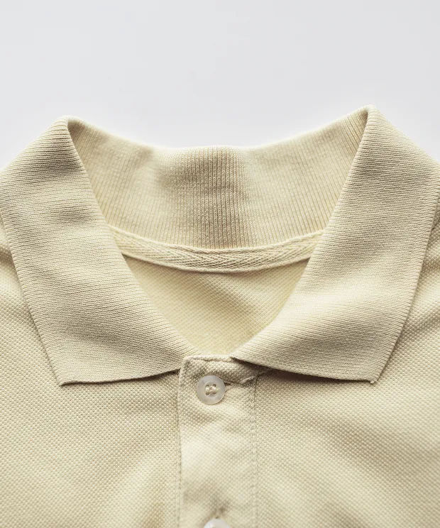 Light yellow polo shirt close up