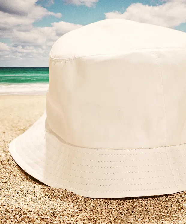 Bucket hat in the sand on the beach