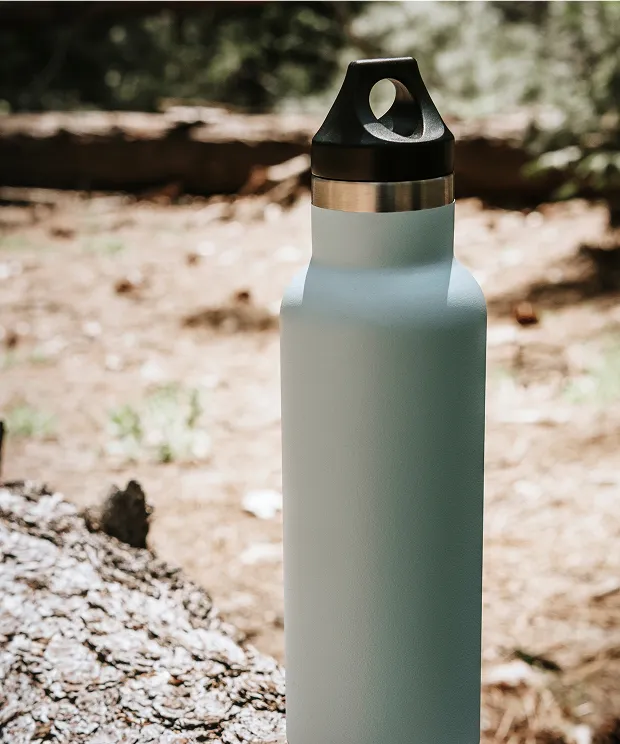 Metal water bottle outside in the woods