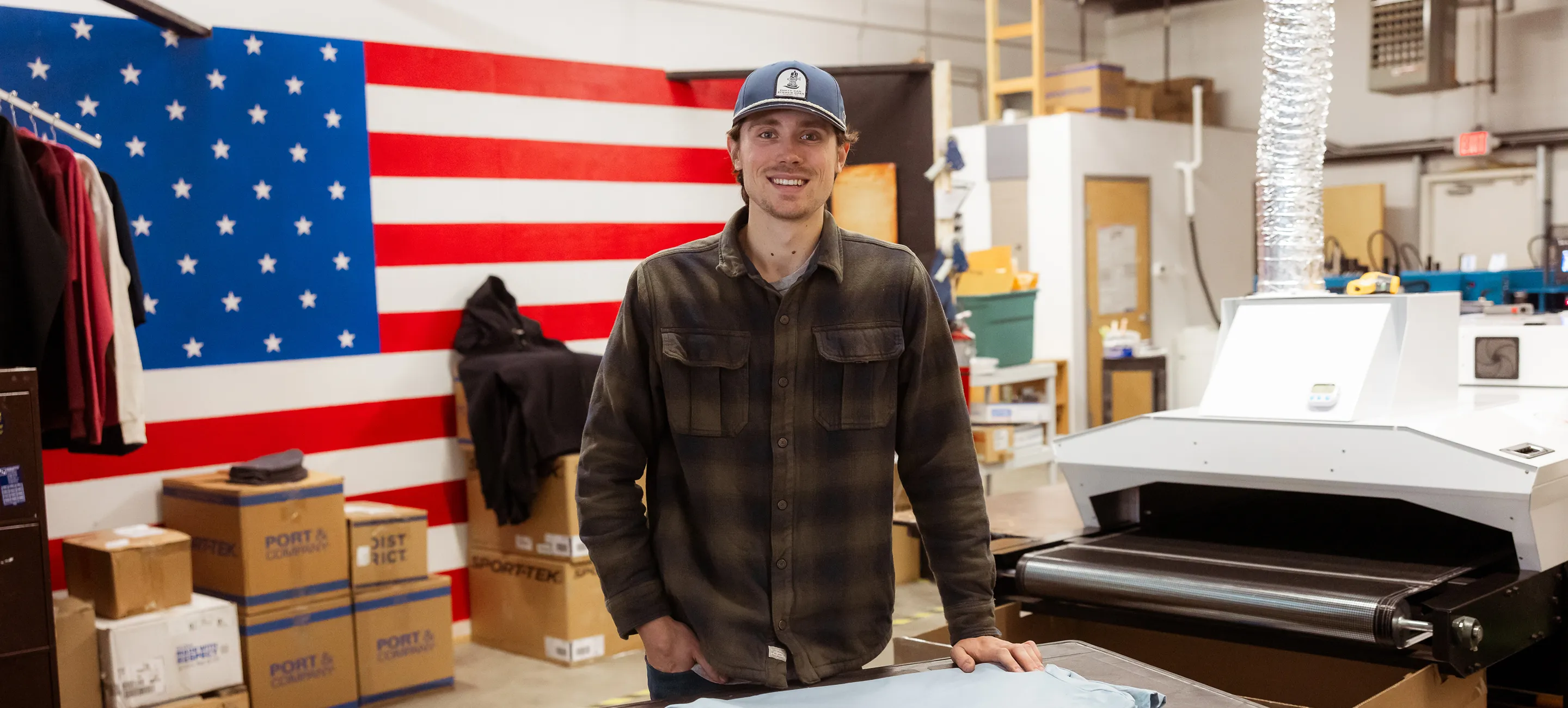 Image of Ben standing in the print shop