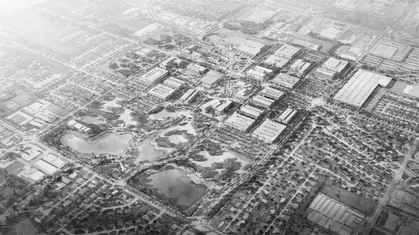 Black and white aerial sketch of a residential neighborhood with modern apartment buildings and houses surrounded by trees.