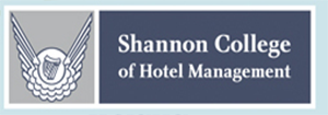 Shannon College of Hotel Management logo with winged emblem and text on a blue background.