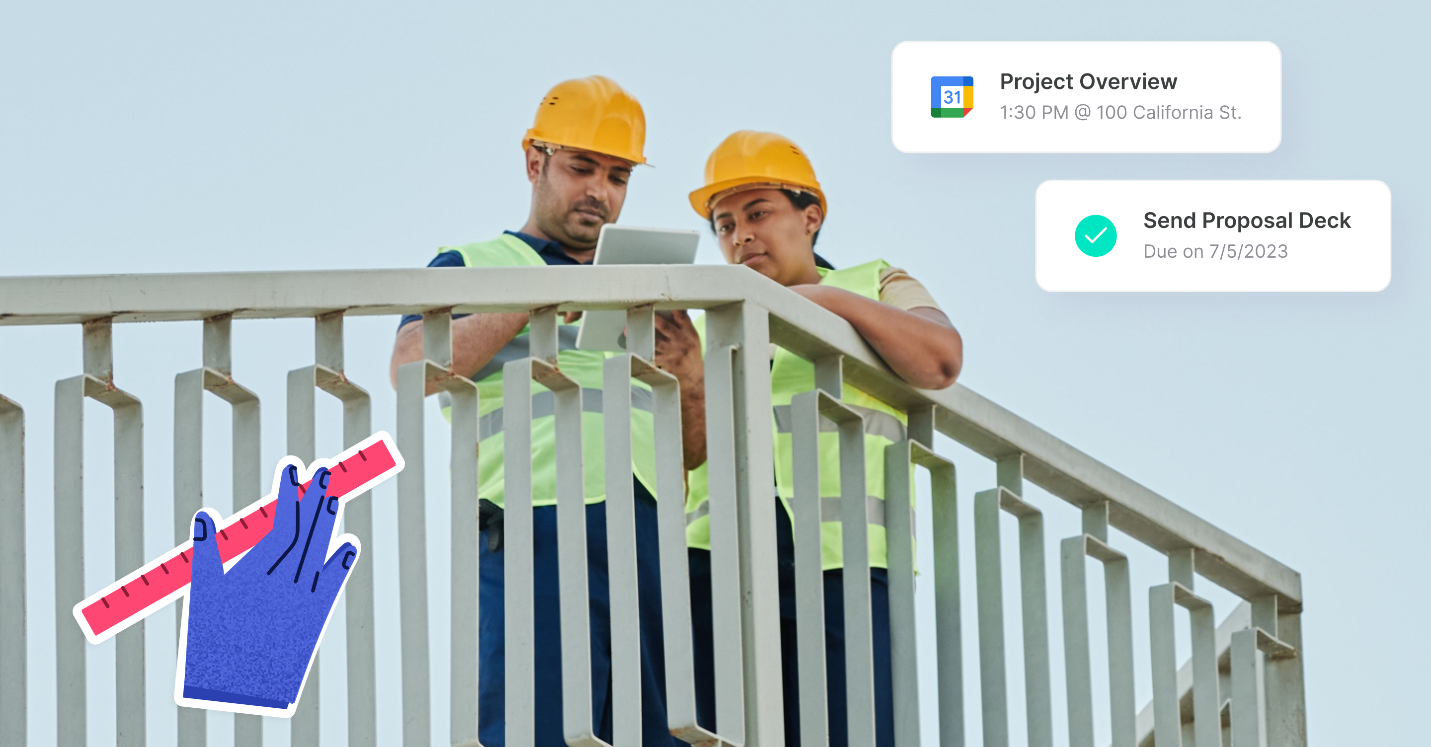 two workers looking at an ipad in construction field