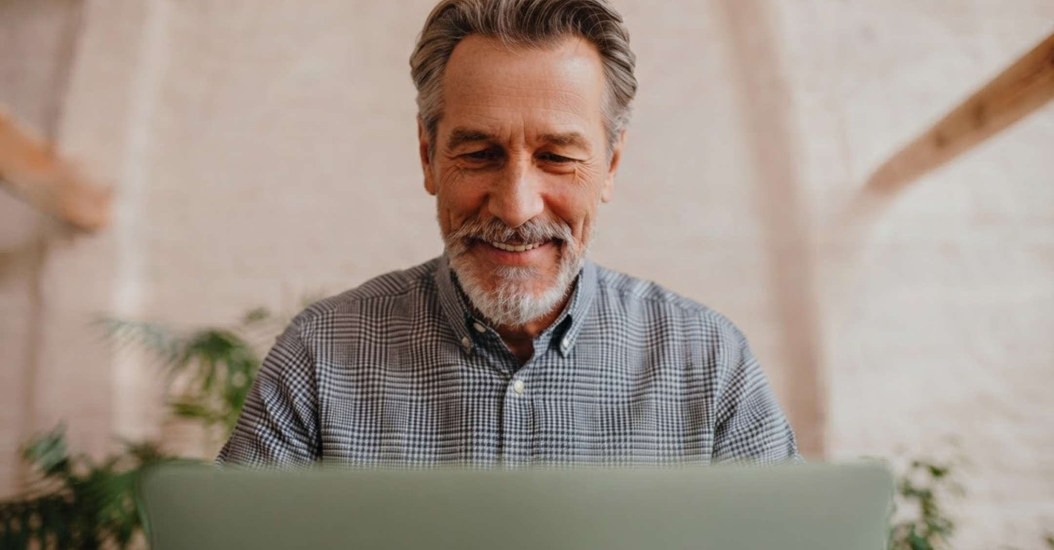 older male businessman on laptop