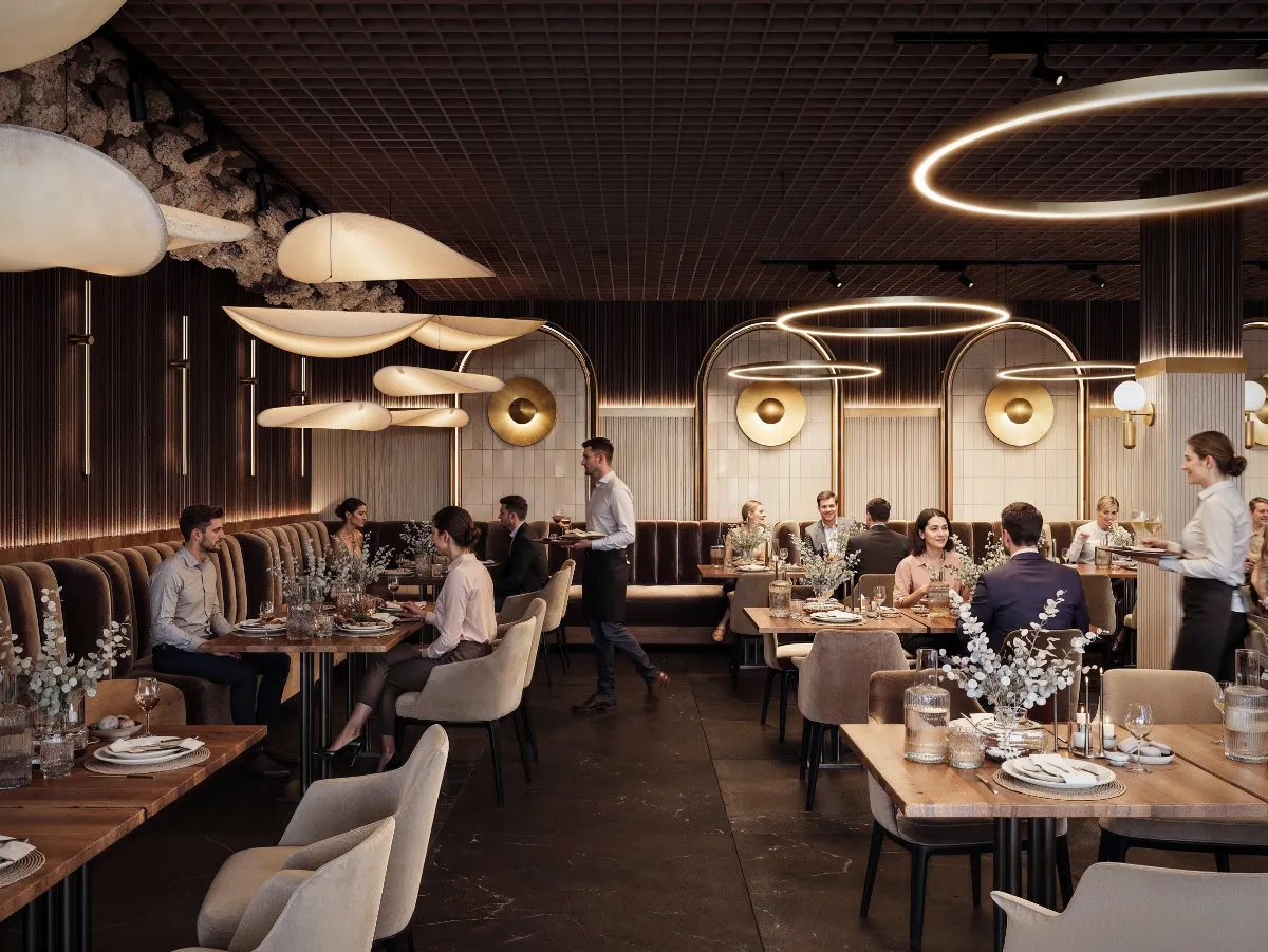 Elegancka sala bankietowa z nowoczesnym oświetleniem i klientami przy stolikach, obsługiwana przez kelnerów.