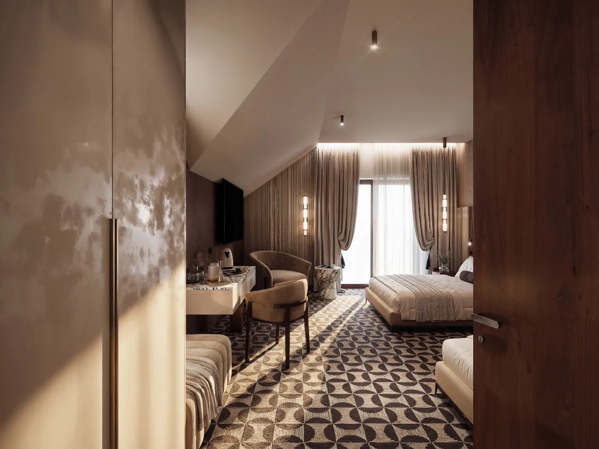 Elegancki hotelowy pokój z dużym łóżkiem, fotelem, biurkiem i ozdobnym wzorzystym dywanem.