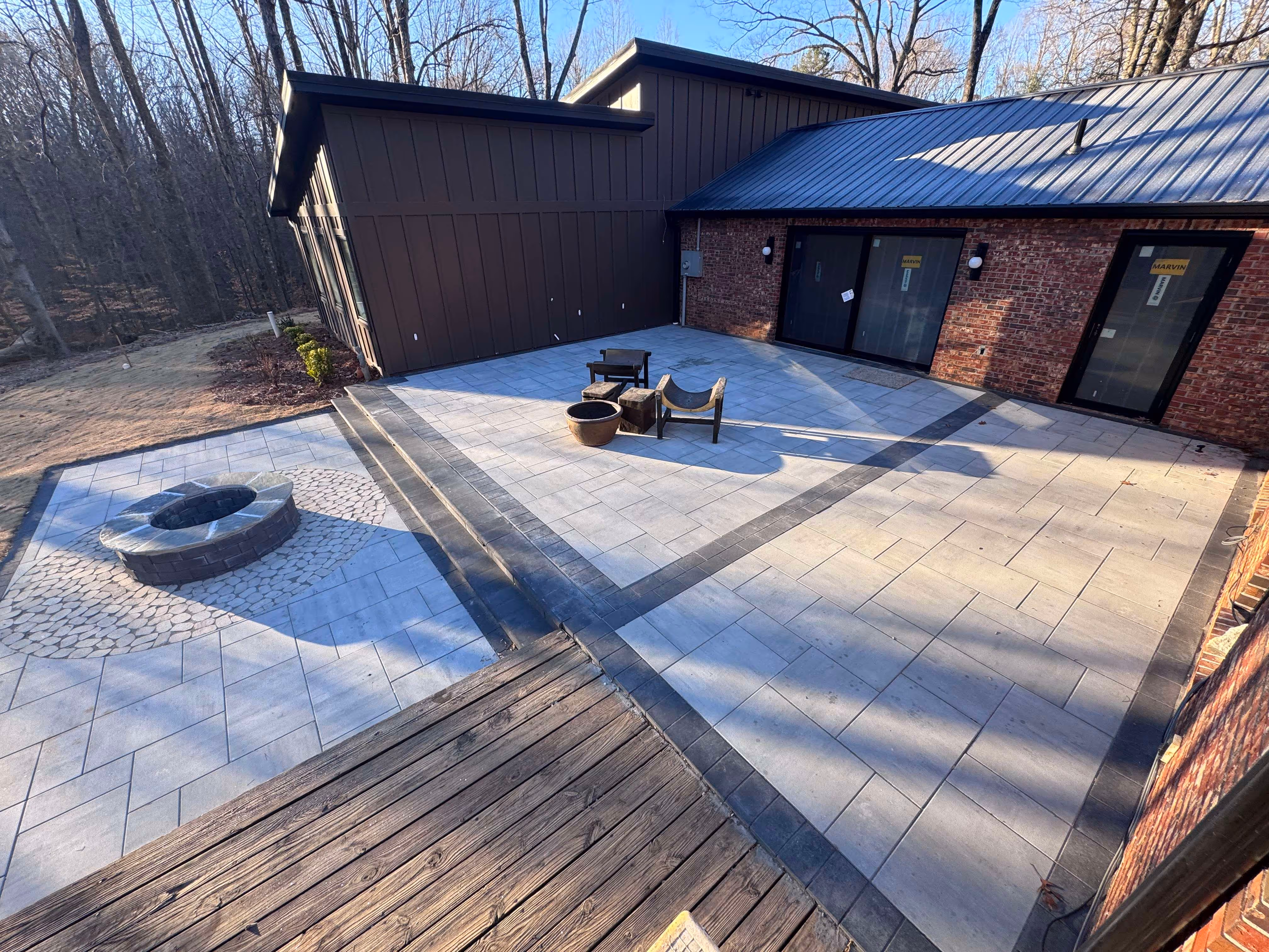 paver patio and fire pit with home in background