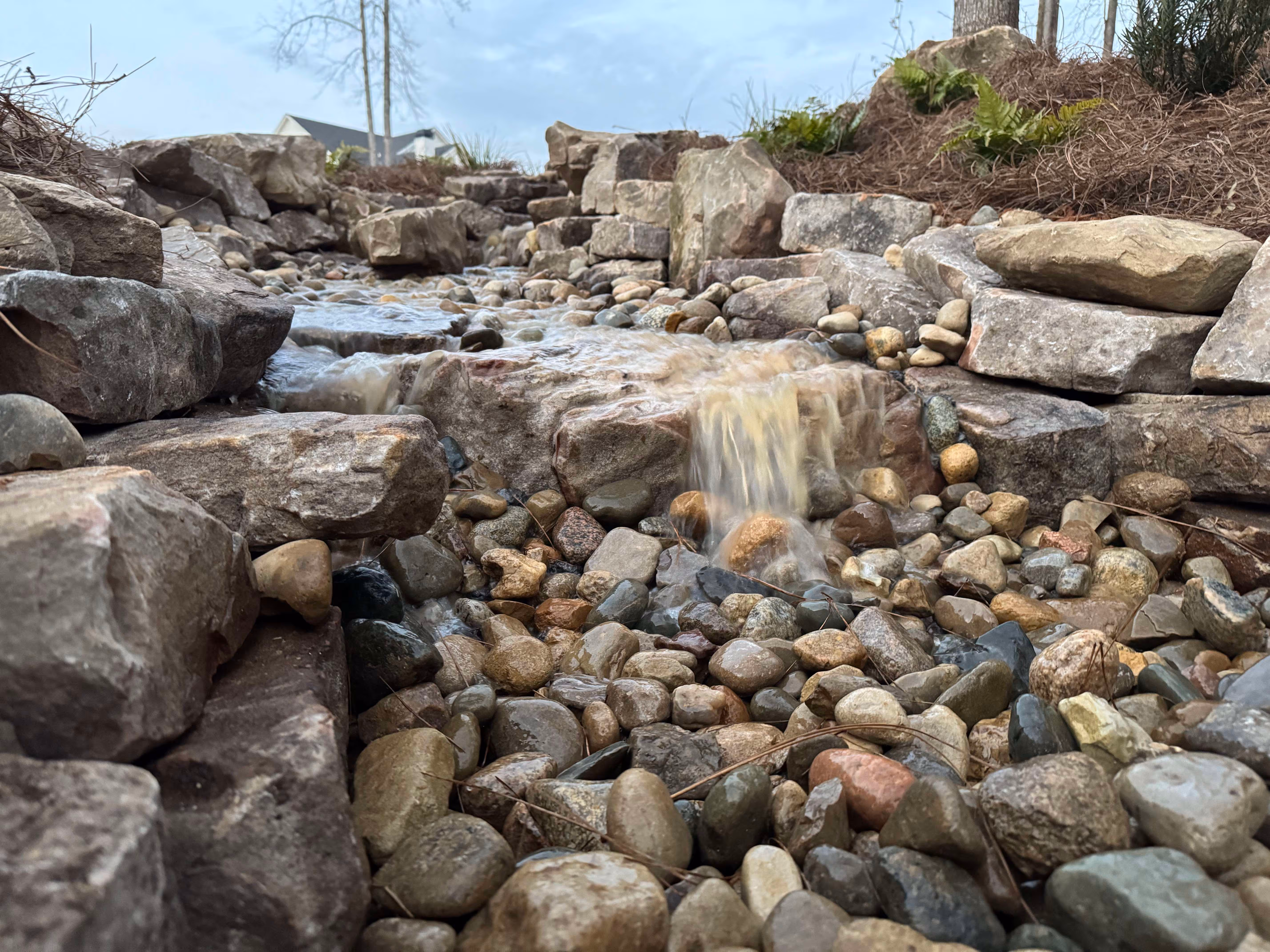 stone water feature with water descending from top level 